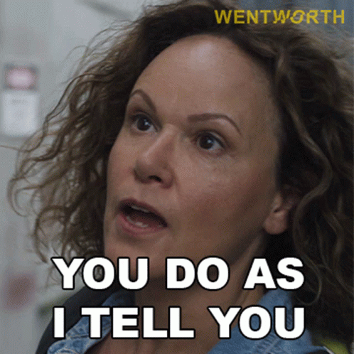 a woman says " you do as i tell you " in white letters
