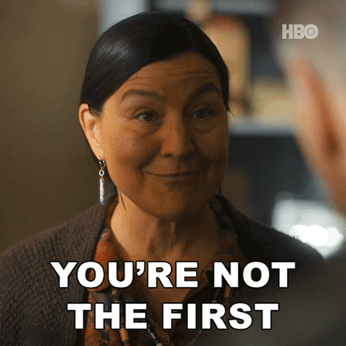 A Woman Says " You 'Re Not The First " While Smiling GIF
