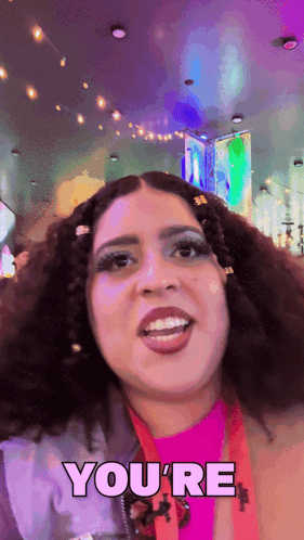 A Woman Says " You 'Re " While Smiling GIF
