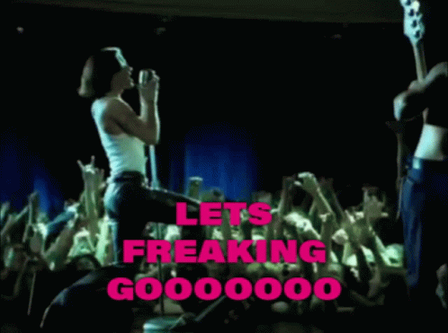 A Woman Singing Into A Microphone In Front Of A Crowd With The Words Lets Freaking Go000000 Written In Pink GIF