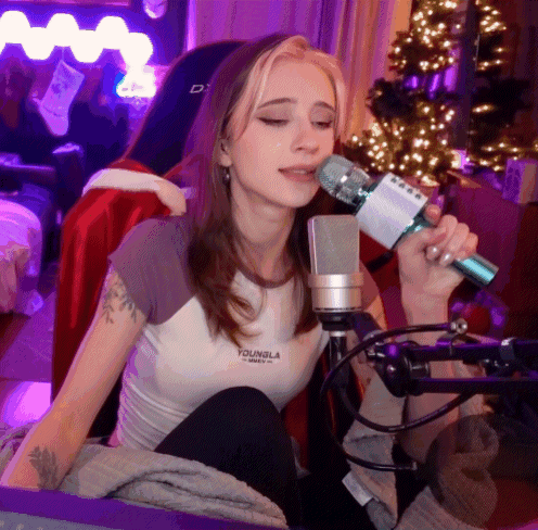 a woman singing into a microphone that says youngla