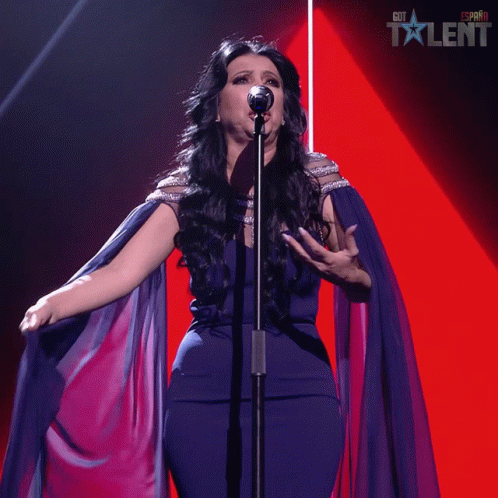 A Woman Singing Into A Microphone With A Red Background That Says Got Talent On It GIF