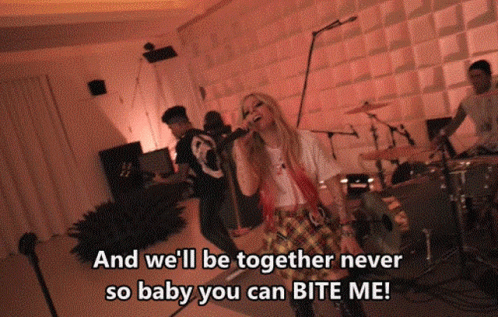 A Woman Singing Into A Microphone With The Words " And We 'Ll Be Together Never So Baby You Can Bite Me " Below Her GIF