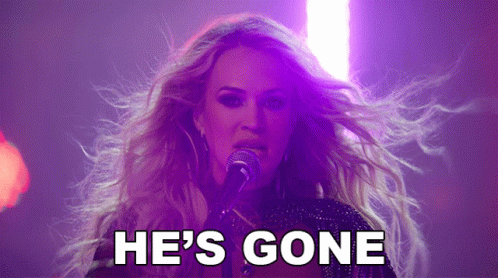 A Woman Singing Into A Microphone With The Words " He 'S Gone " Behind Her GIF
