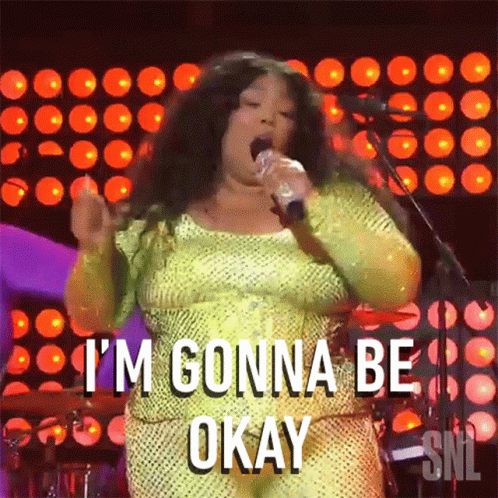 A Woman Singing Into A Microphone With The Words I 'M Gonna Be Okay GIF