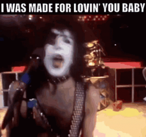 A Woman Singing Into A Microphone With The Words " I Was Made For Lovin ' You Baby " Above Her GIF