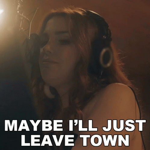 A Woman Singing Into A Microphone With The Words Maybe I 'Ll Just Leave Town On The Bottom GIF