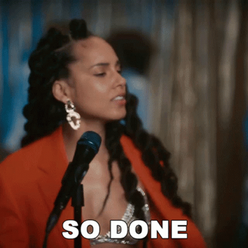 A Woman Singing Into A Microphone With The Words So Done Written On The Bottom GIF