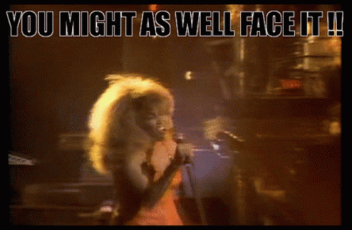 A Woman Singing Into A Microphone With The Words " You Might As Well Face It " Below Her GIF