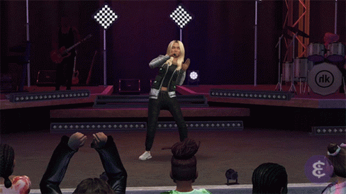 A Woman Singing On A Stage In Front Of A Drum Set That Says Rk GIF