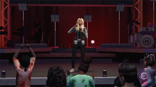 A Woman Singing On A Stage With A Nk Logo In The Corner GIF