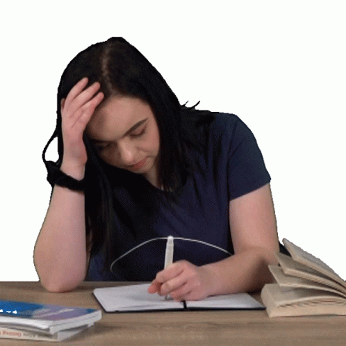 A Woman Sits At A Desk With A Book That Says " Getting Started " GIF