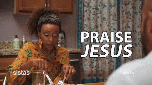 A Woman Sits At A Table With A Knife And Fork And The Words Praise Jesus Above Her GIF