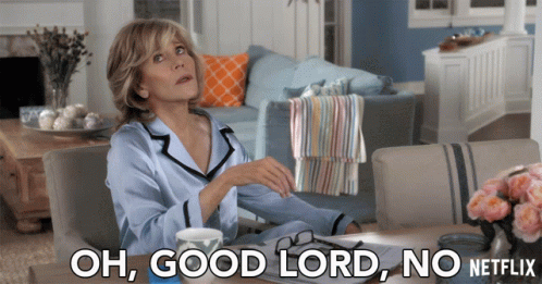 A Woman Sits At A Table With The Words Oh Good Lord No Netflix Written Below Her GIF