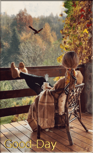 A Woman Sits In A Chair On A Balcony With A Cup Of Coffee And The Words " Good Day " Above Her GIF