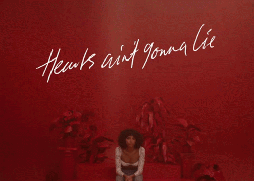 Woman Sitting In Front Of Red Wall Hearts Ain't Gonna Lie GIF