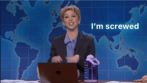 A Woman Sitting At A Desk With A Laptop And The Words I 'M Screwed Above Her GIF