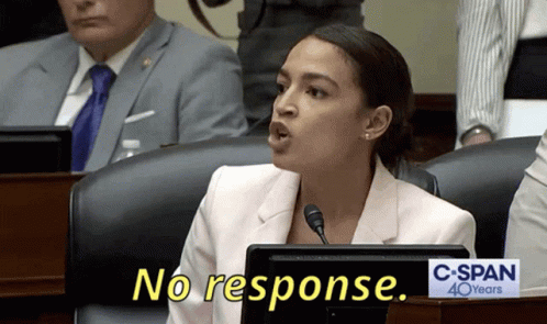 A Woman Sitting At A Desk With A Sign That Says C-Span 40 Years GIF