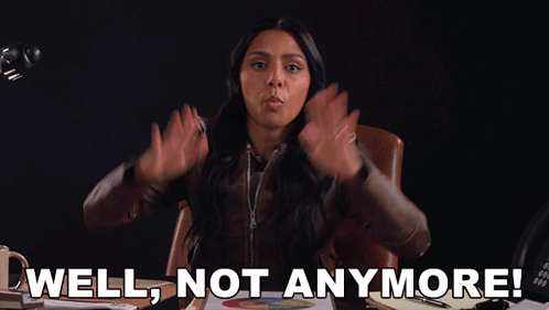 A Woman Sitting At A Desk With Her Hands In The Air And The Words Well Not Anymore GIF