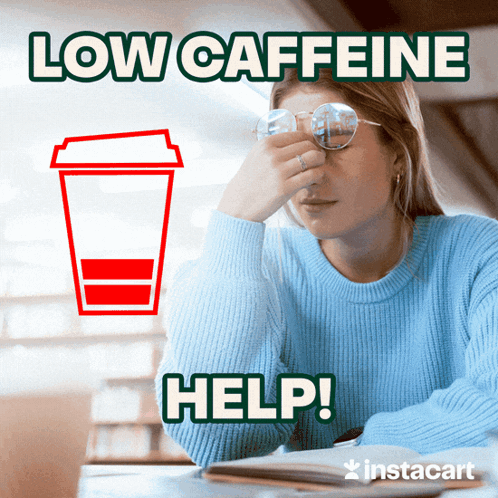 A Woman Sitting At A Table With A Cup Of Coffee Next To Her And The Words Low Caffeine Help GIF