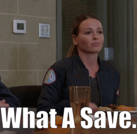 a woman sitting at a table with a glass of water and the words what a save on the bottom