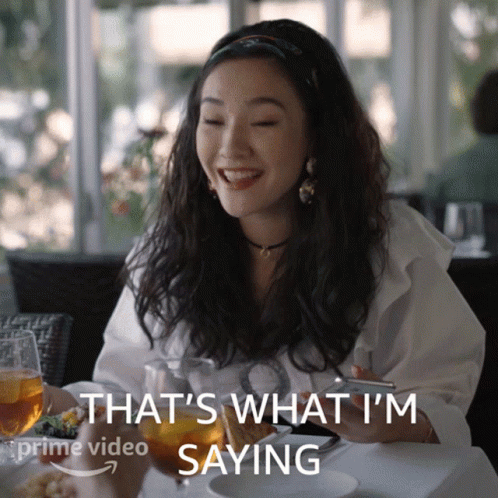 A Woman Sitting At A Table With A Glass Of Wine Says That 'S What I 'M Saying On The Bottom GIF