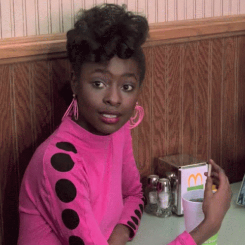 Woman Sitting At Table With McDonald's Menu GIF