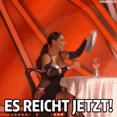 A Woman Sitting At A Table With A Plate In Her Hand And The Words Es Reicht Jetzt GIF