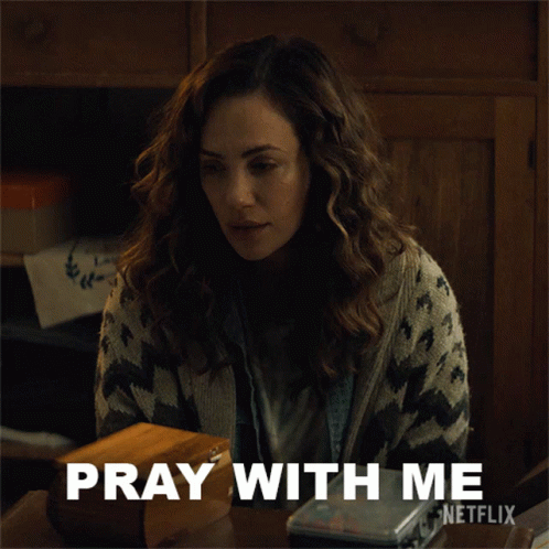 A Woman Sitting At A Table With The Words Pray With Me Netflix GIF