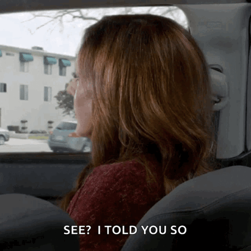 A Woman Sitting In A Car With The Words See I Told You So Below Her GIF