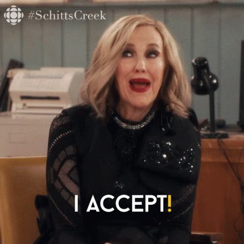A Woman Sitting In A Chair With Her Mouth Open And The Words I Accept Below Her GIF