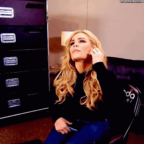 A Woman Sitting In A Chair With The Word Da On The Back GIF