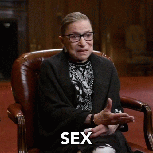 A Woman Sitting In A Chair With The Word Discrimination Written On The Bottom GIF