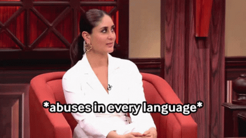 A Woman Sitting In A Chair With The Words Abuses In Every Language Written Below Her GIF