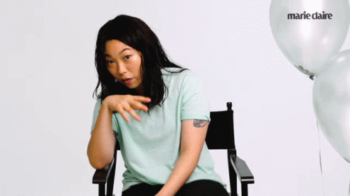 A Woman Sitting In A Chair With The Words Are They Confuse On The Bottom GIF