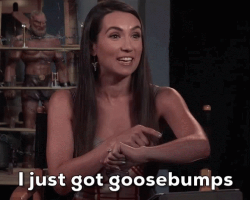 A Woman Sitting In A Chair With The Words I Just Got Goosebumps On The Screen GIF