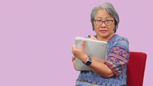 A Woman Sitting In A Chair With The Words I 'M Listening Above Her GIF