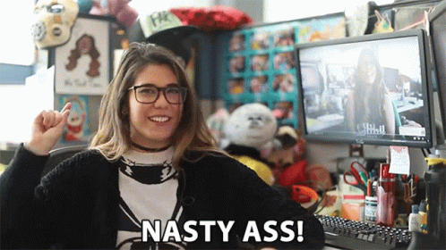 A Woman Sitting In Front Of A Computer With The Words Nasty Ass Written On The Bottom GIF