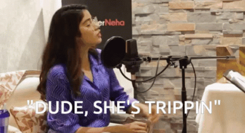 A Woman Sitting In Front Of A Microphone With The Words " Dude She 'S Trippin " GIF