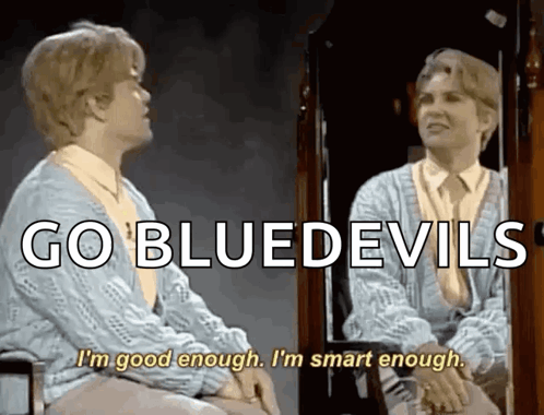 A Woman Sitting In Front Of A Mirror With The Words Go Bluedevils Written Above Her GIF