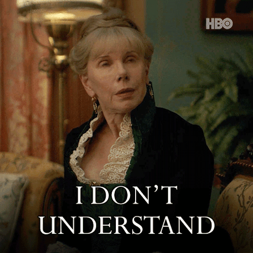 A Woman Sitting In Front Of A Sign That Says I Don 'T Understand On It GIF