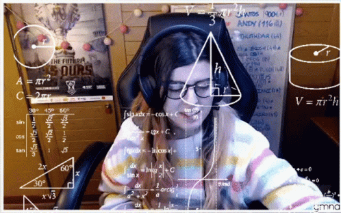 A Woman Sitting In Front Of A White Board With Math Equations GIF