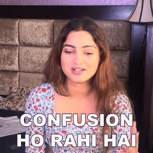 A Woman Sitting On A Bed With The Words Confusion Ho Rahi Hai Above Her GIF