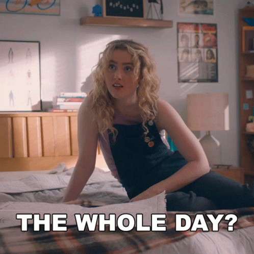 A Woman Sitting On A Bed With The Words " The Whole Day " Next To Her GIF