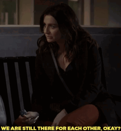 A Woman Sitting On A Bench With The Words " We Are Still There For Each Other Okay " GIF