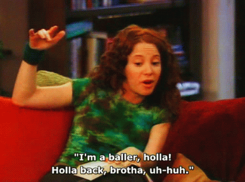 A Woman Sitting On A Couch Says " I 'M A Baller, Holla " GIF