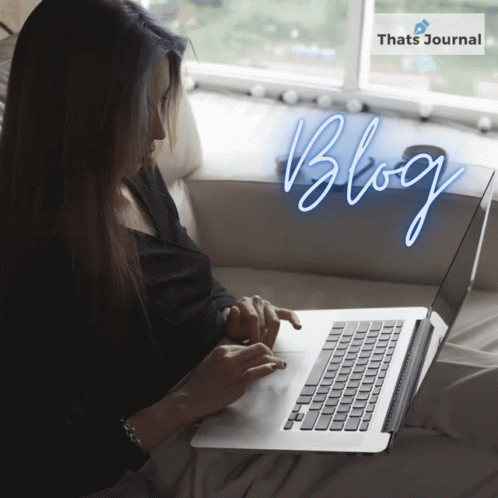 A Woman Sitting On A Couch Using A Laptop With The Word Blog Written In Neon GIF