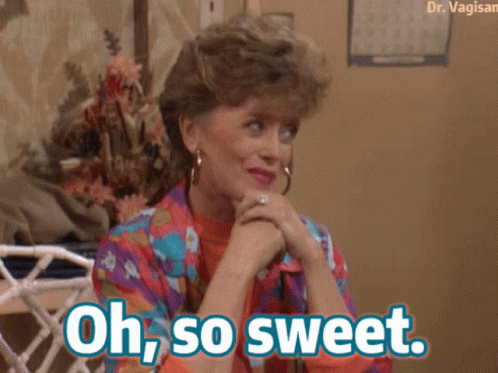 A Woman Sitting On A Couch With Her Hands Folded And The Words Oh So Sweet Above Her GIF