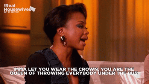 A Woman Sitting On A Couch With The Words " Imma Let You Wear The Crown " On The Bottom GIF