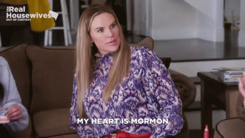 A Woman Sitting On A Couch With The Words My Heart Is Mormon GIF